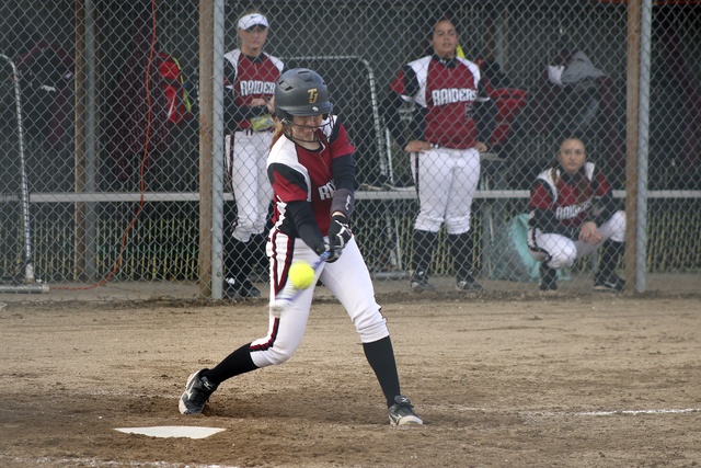 Thomas Jefferson’s Kayla Gaerttner hits for a single in the bottom of the fifth inning of Jefferson’s 16-12 win over Kentlake on March 28 at Thomas Jefferson High School. The Raiders scored six runs in the bottom of the fifth. TERRENCE HILL