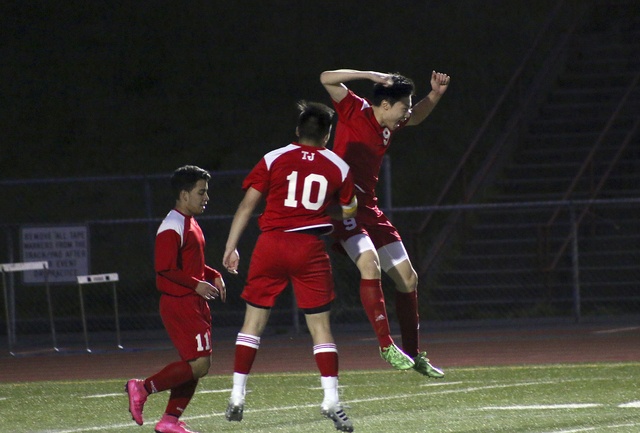 Chris Oh (right) celebrates after scoring the third goal for Thomas Jefferson during their 3-2 win over Todd Beamer on April 26. TERRENCE HILL