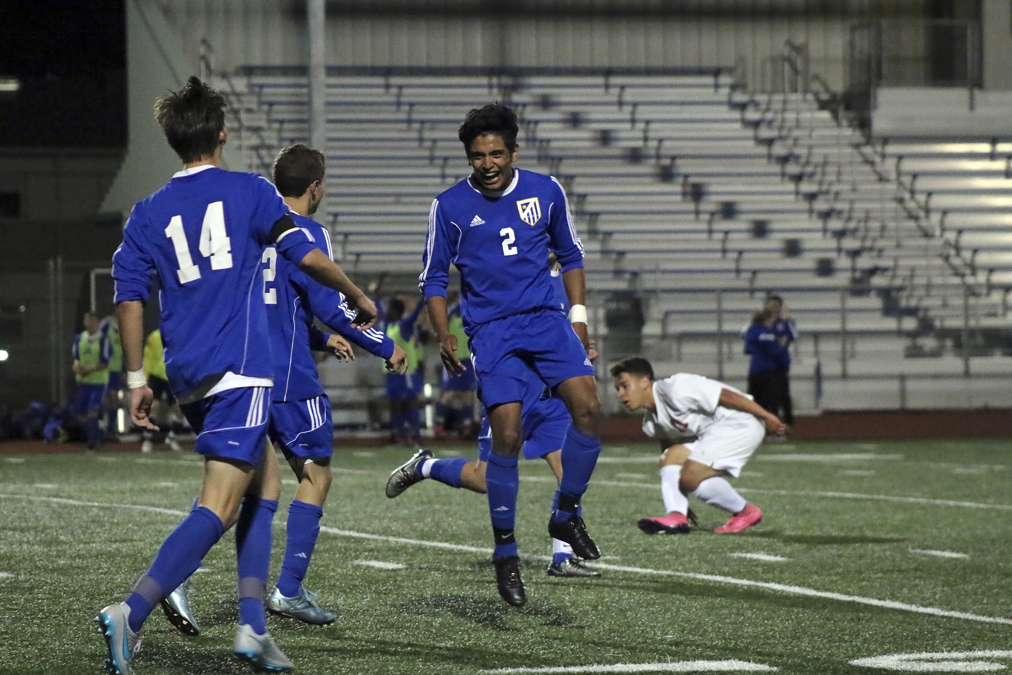 Tahoma players Cris Garfias (right) celebrates with teammates Robby Guyer (middle) and Charlie Wilcox (left) after the Bears’ second goal of the night during their 2-0 win against Thomas Jefferson in the West Central District tourmament on May 12 at Curtis’ Viking Stadium. TERRENCE HILL