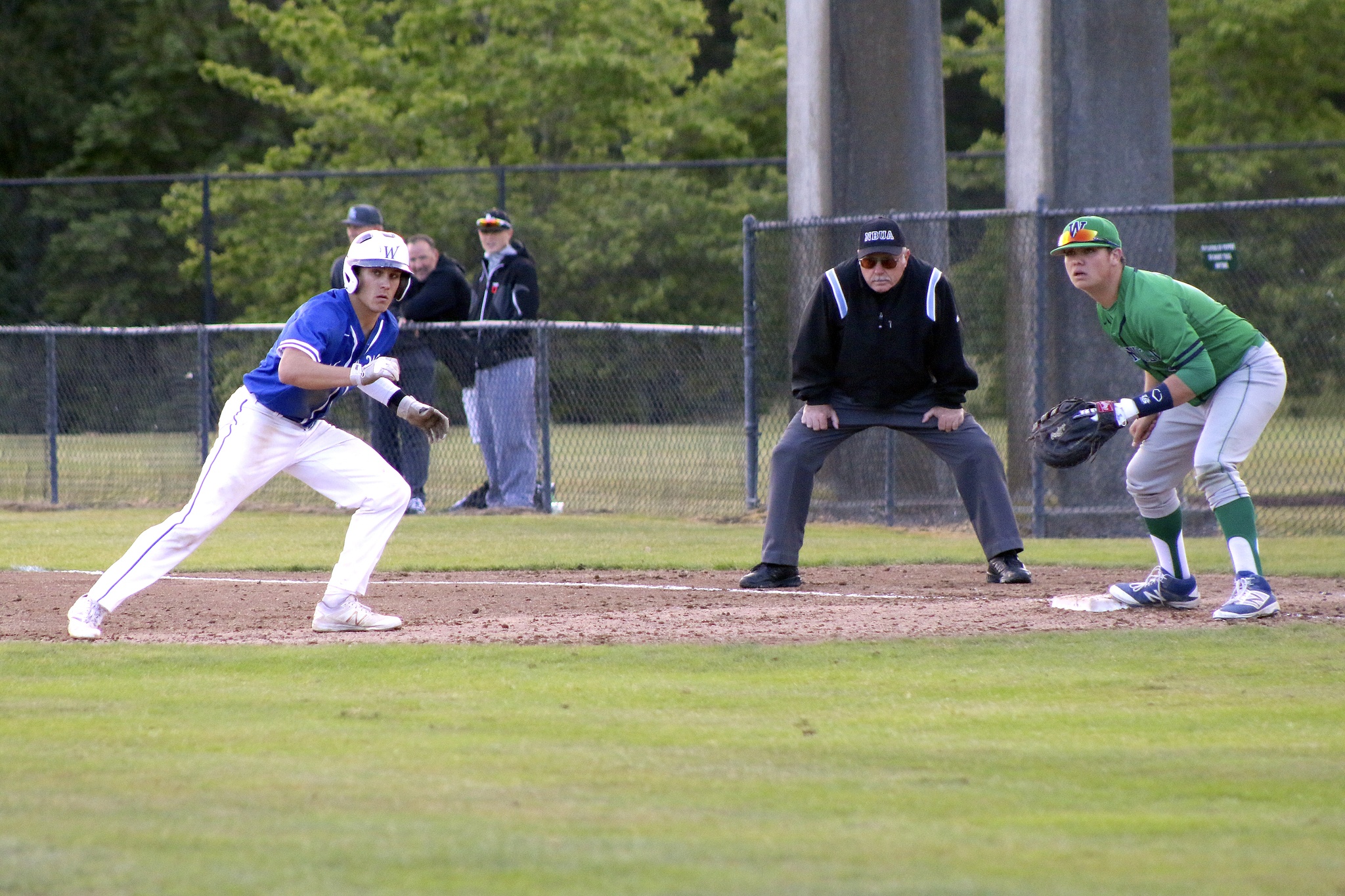 Federal Way's Ben Koler heads back to first base during a pick-off attempt in the first inning of the May 22 state playoff game against Woodinville at Heidelberg Park in Tacoma. TERRENCE HILL