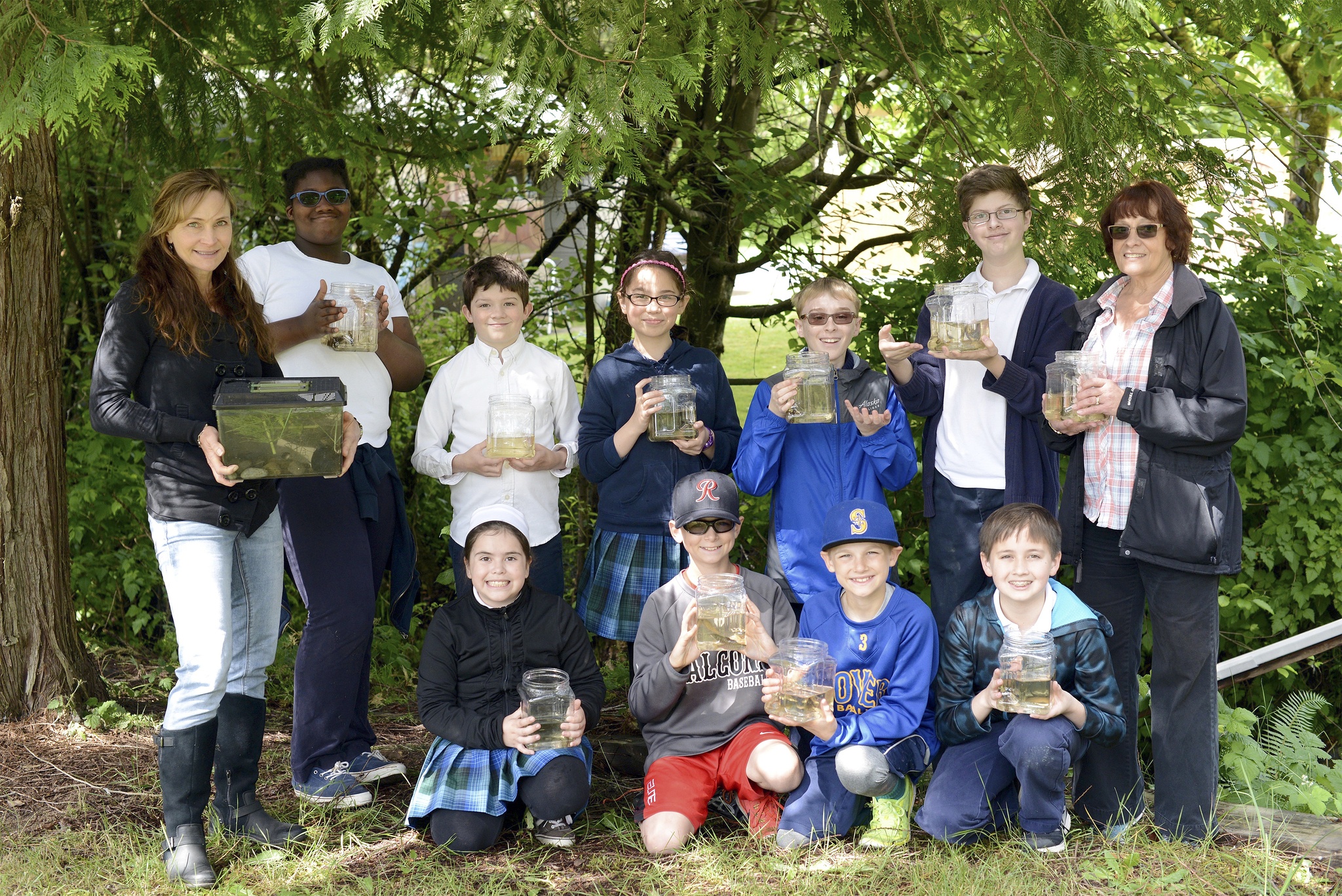 Montessori Academy students and staff pose with their salmon that they have raised to be released into West Hylebos Creek. Contributed photo