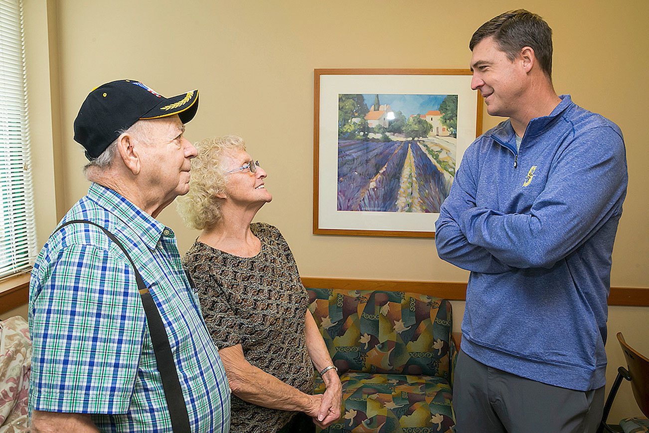 Dan Wilson takes time to visit with local patients