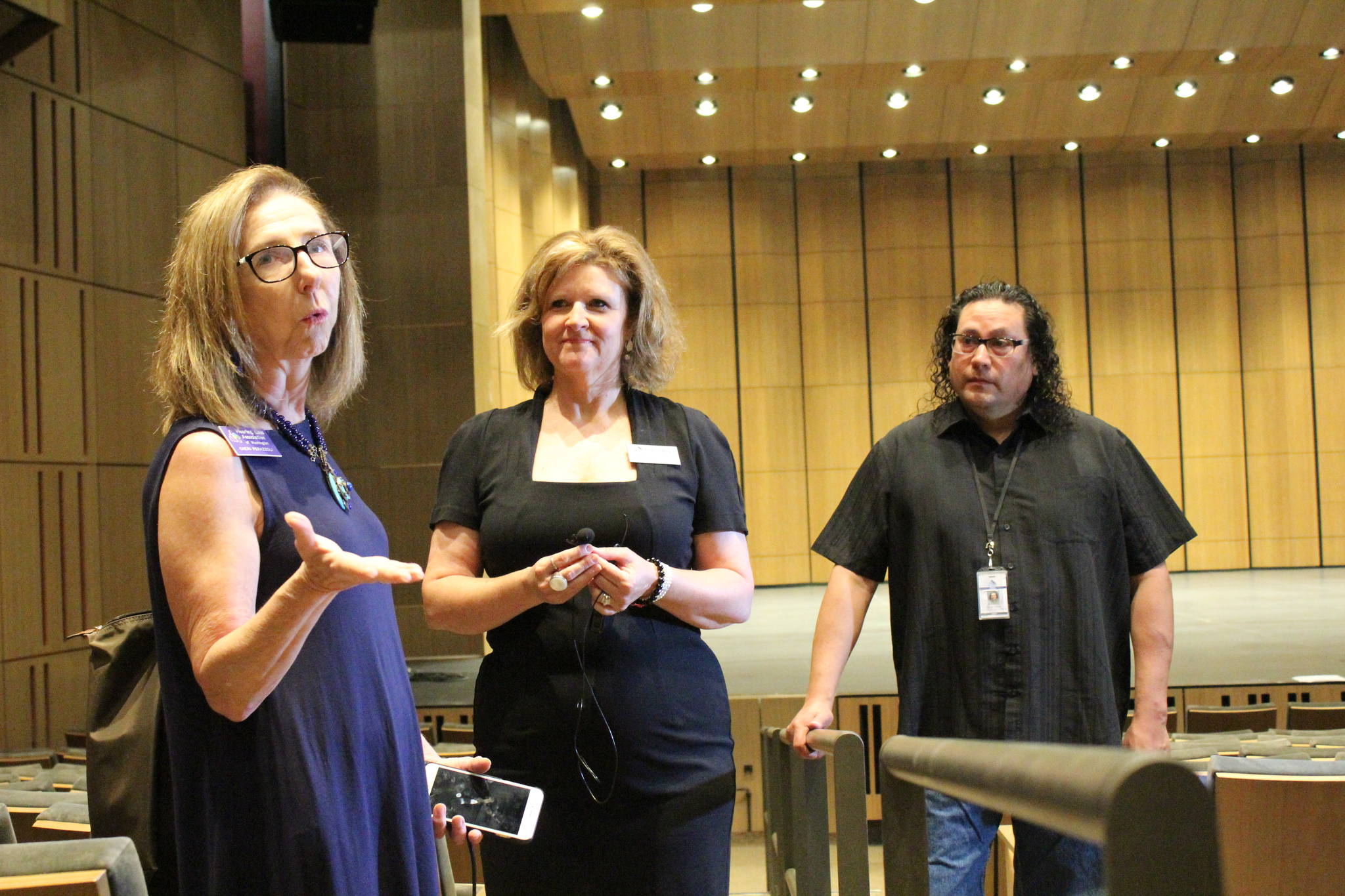 Cheri Perazzoli, left, of the Hearing Loss Association of Washington praises the Hearing Loop technology during an Aug. 3 tour of the Performing Arts and Event Center in Federal Way.