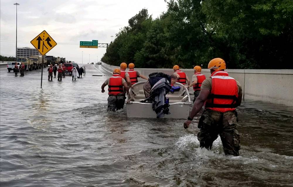 Soldiers with the Texas Army National Guard move through flooded Houston streets as floodwaters from Hurricane Harvey continue to rise, Monday, August 28, 2017. (U.S. Army photo by 1st Lt. Zachary West)