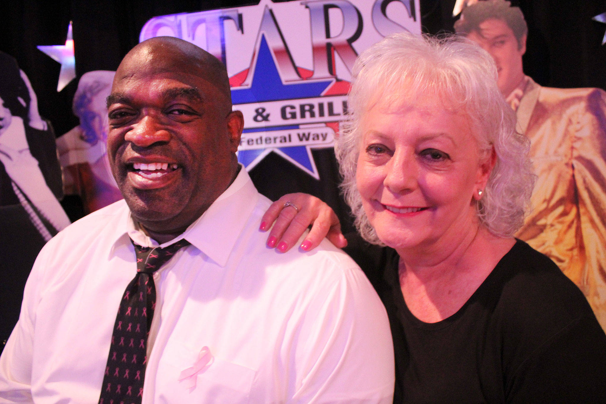 Cliff Satterwhite, pictured with Stars Bar and Grill owner Teena Nelson, recently completed a 36-hour karaoke marathon singing the Garth Brooks song “Friends in Low Places.” (Photo by Andy Hobbs, the Mirror)