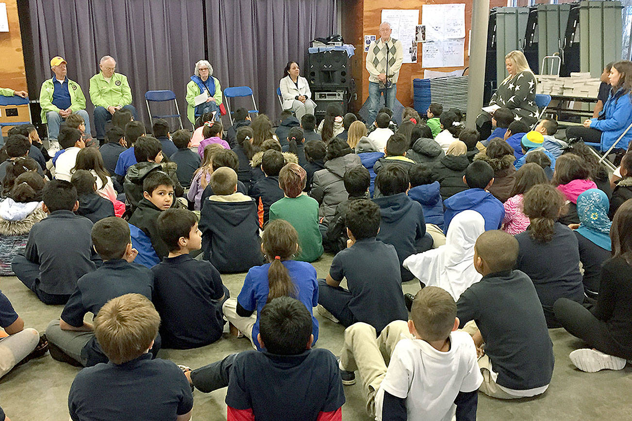 Lions Club presents district third-graders with dictionaries