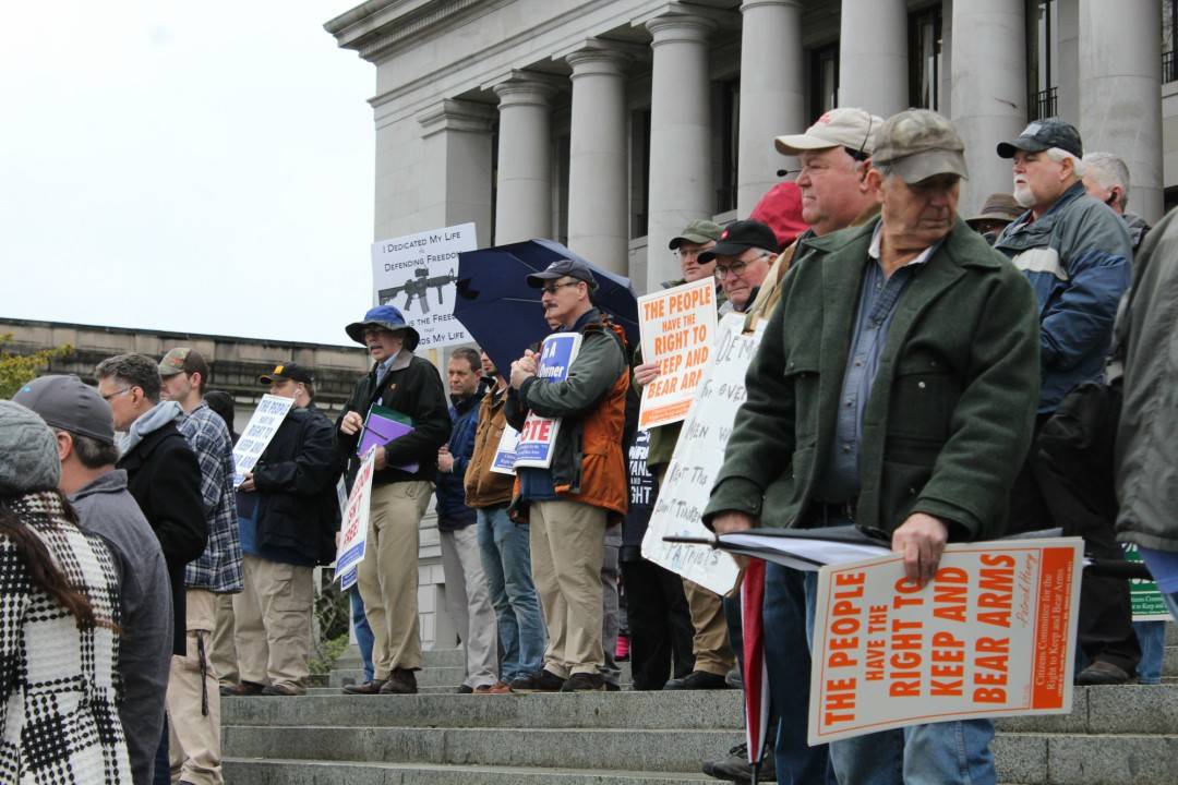 Pro-gun activists gather on the steps of the Capitol building for a rally on Friday. Photo by Taylor McAvoy/WNPA Olympia News Bureau