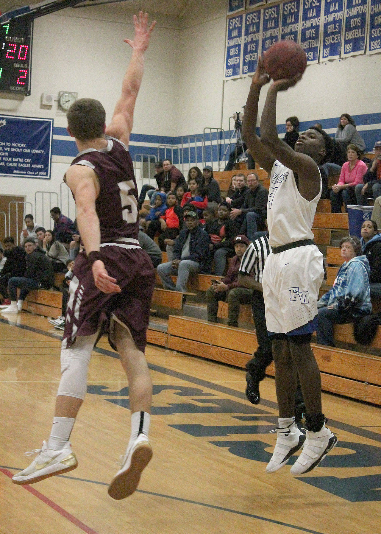 Eagles boys hold off Hornets, secure strong lead atop standings