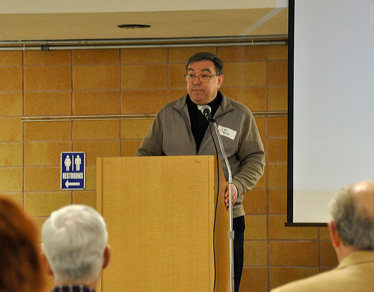 The Rev. Bill McKee, priest at St. Vincent De Paul Parish in Federal Way, speaks about the positive encounters that have occured since the Federal Way Day Center opened. The center celebrated its first anniversary at St. Vincent De Paul’s social hall. Heidi Sanders, the Mirror
