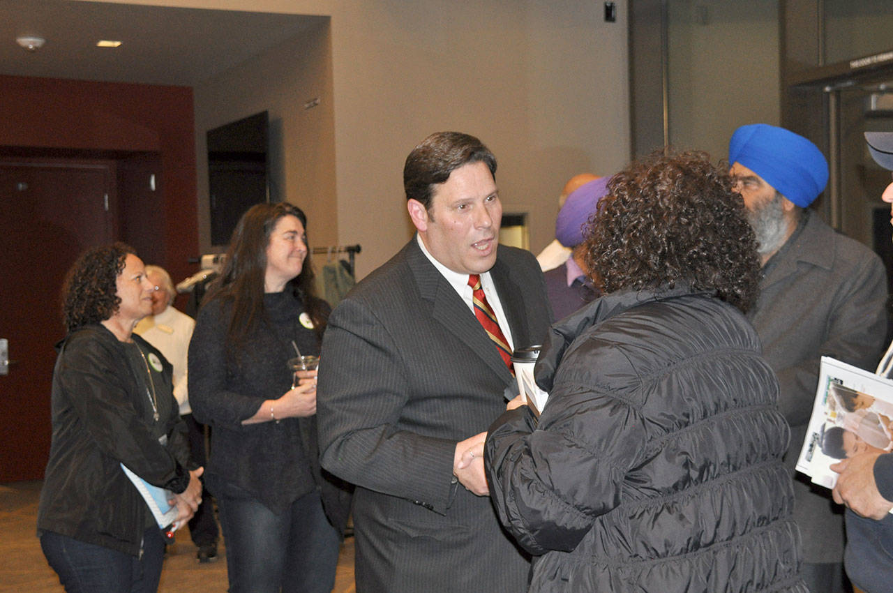 Mayor Jim Ferrell greets community members after his State of the City address on Monday. HEIDI SANDERS, the Mirror