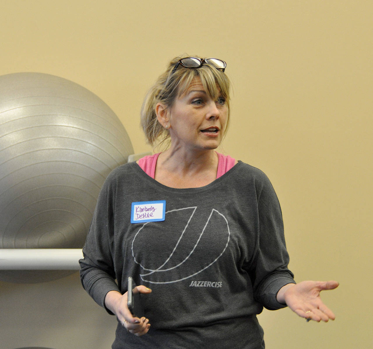 Kimberly DeMile, owner of Federal Way Jazzercise, speaks during a Business Among Moms networking meeting on Tuesday. DeMile started a local chapter of the women’s networking last month. Heidi Sanders, the Mirror