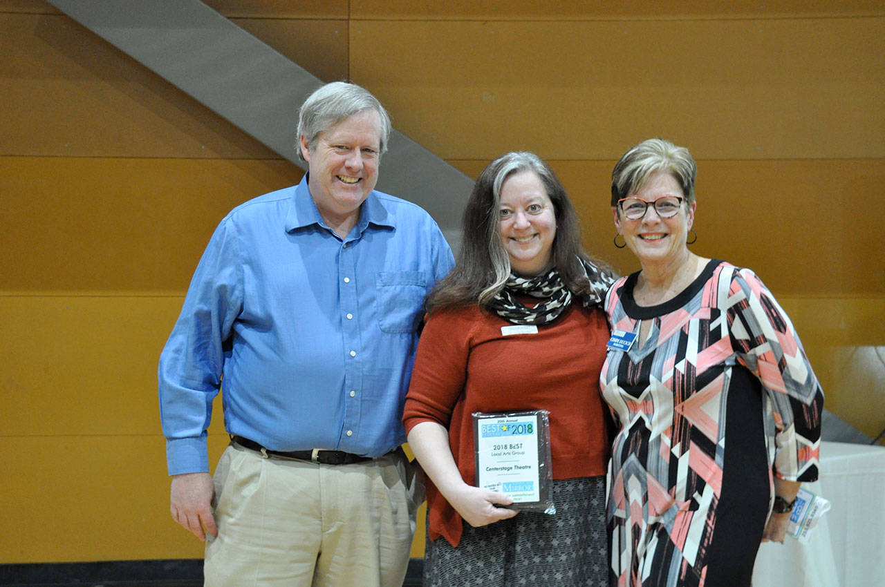 Dave Monteith, left, and Angela Bayler, center, from Centerstage Theatre, winner of best local arts group, with Mirror sales consultant Cindy Ducich. Heidi Sanders, the Mirror