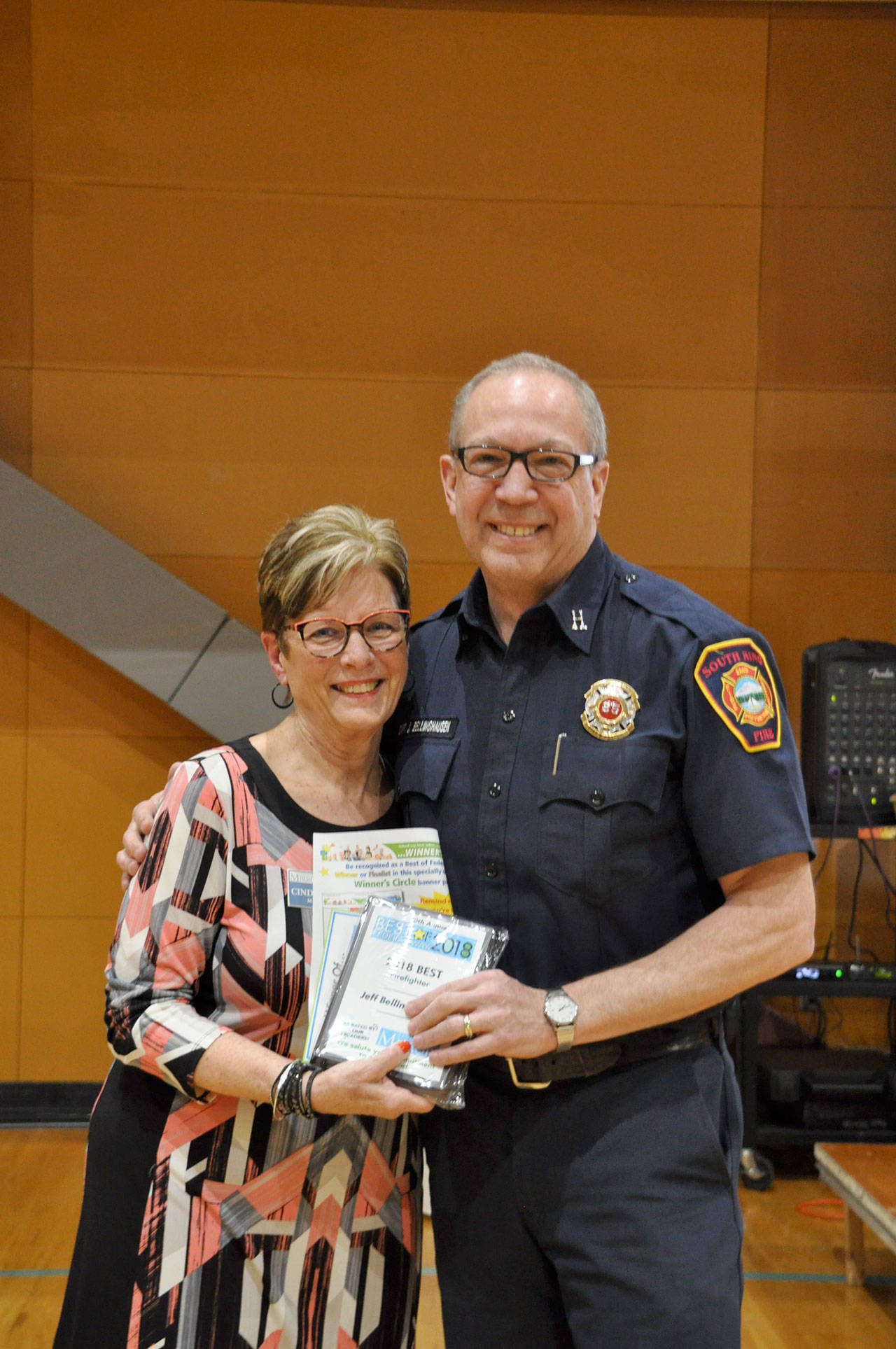 South King Fire & Rescue Capt. Jeff Bellinghausen, best firefighter winner, right, and Mirror sales consultant Cindy Ducich. Heidi Sanders, the Mirror