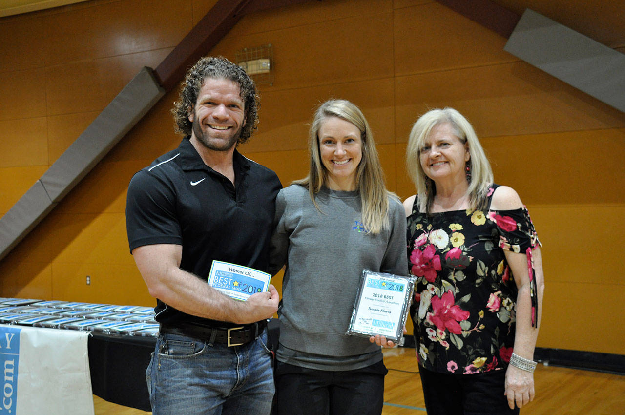 Mirror sales consultant Linda Staples, right, and Dan and Brynn Esbenshade, owners of Temple Fitness, winner of best fitness facility. Heidi Sanders, the Mirror
