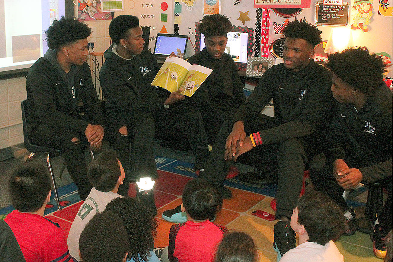 Federal Way High boys basketball players celebrate Literacy Week with Adelaide students