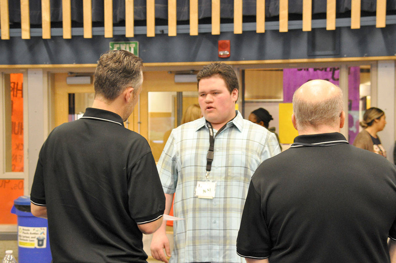 Alijah Bevilacqua, a sophomore at Todd Beamer High School, talks to potential employers during a job fair on Wednesday. Bevilacqua took part in a job training program put on by the YES Network. HEIDI SANDERS, the Mirror