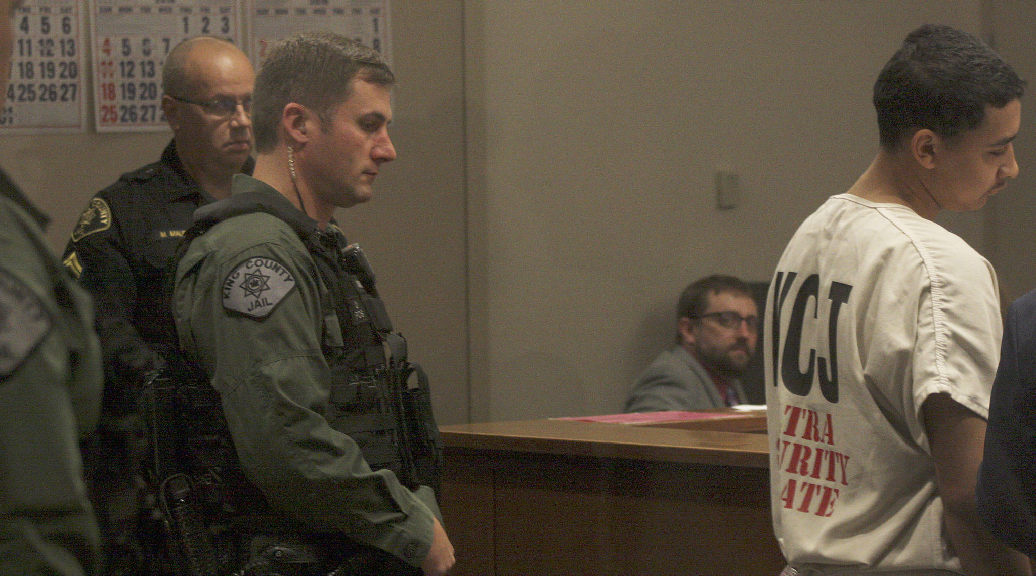 Accompanied by extra King County jail guards, Giovanni D. Herrin appears for his arraignment in King County Superior Court on murder and escape charges. MARK KLAAS, Kent Reporter