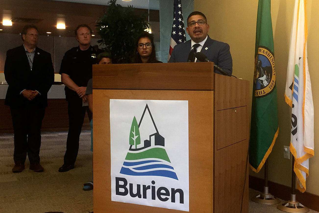 Burien Mayor Jimmy Matta stands alongside family members, Burien Police Chief Ted Boe, and Burien City Manager Brian Wilson at a July 23 press conference. Photo by Josh Kelety