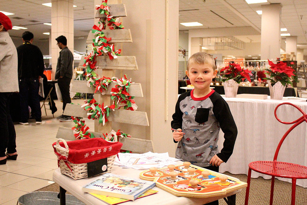 Candy Cane Lane also has activities for kids, such as coloring sheets and toys. Olivia Sullivan/staff photo