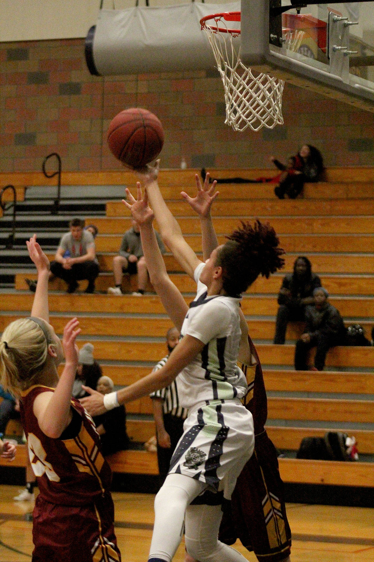 Junior Sharay Trotter, in the white jersey, goes for a layup. The Todd Beamer Titans won 47-30. Olivia Sullivan/staff photo
