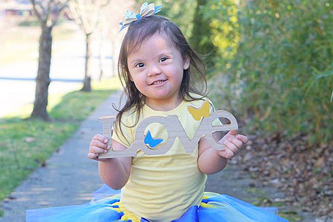 Family of girl with Down syndrome spreads positive messages around city