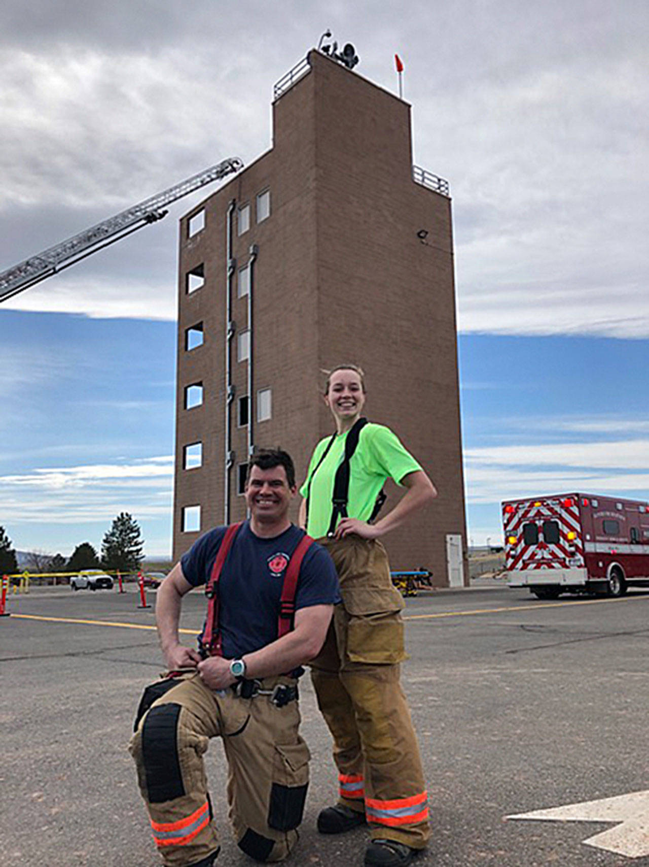 SKFR firefighter Jacob Czekanski, left, and Mirror reporter Olivia Sullivan proudly pose after completing Fire Ops 101 on March 22. Courtesy photo