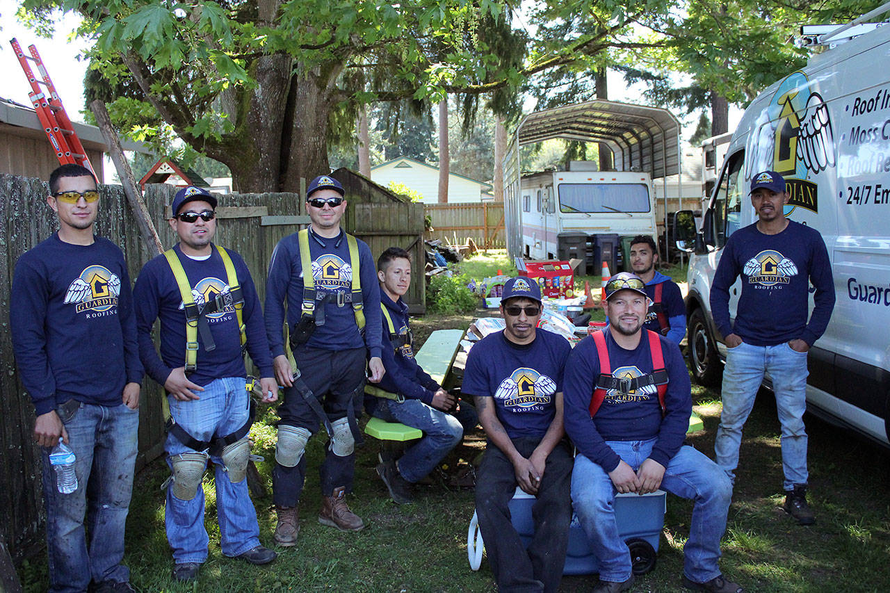 Guardian Roofing employees donated their time and expertise to the Halo Project giveaway. Olivia Sullivan/staff photo