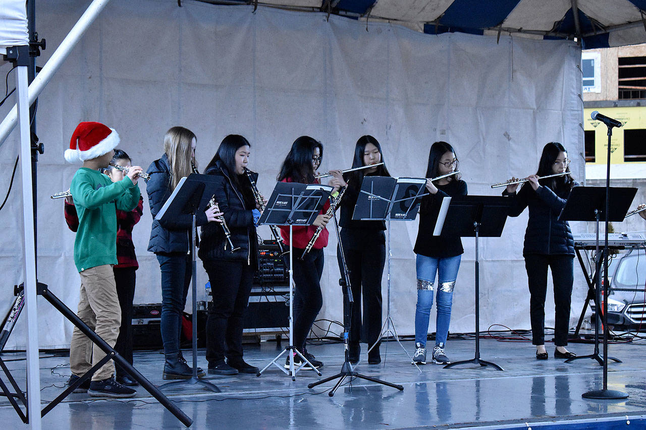 The Federal Way Youth Symphony also performed during the event, entertaining the large crowd with renditions of popular holiday songs. Haley Donwerth/staff photo