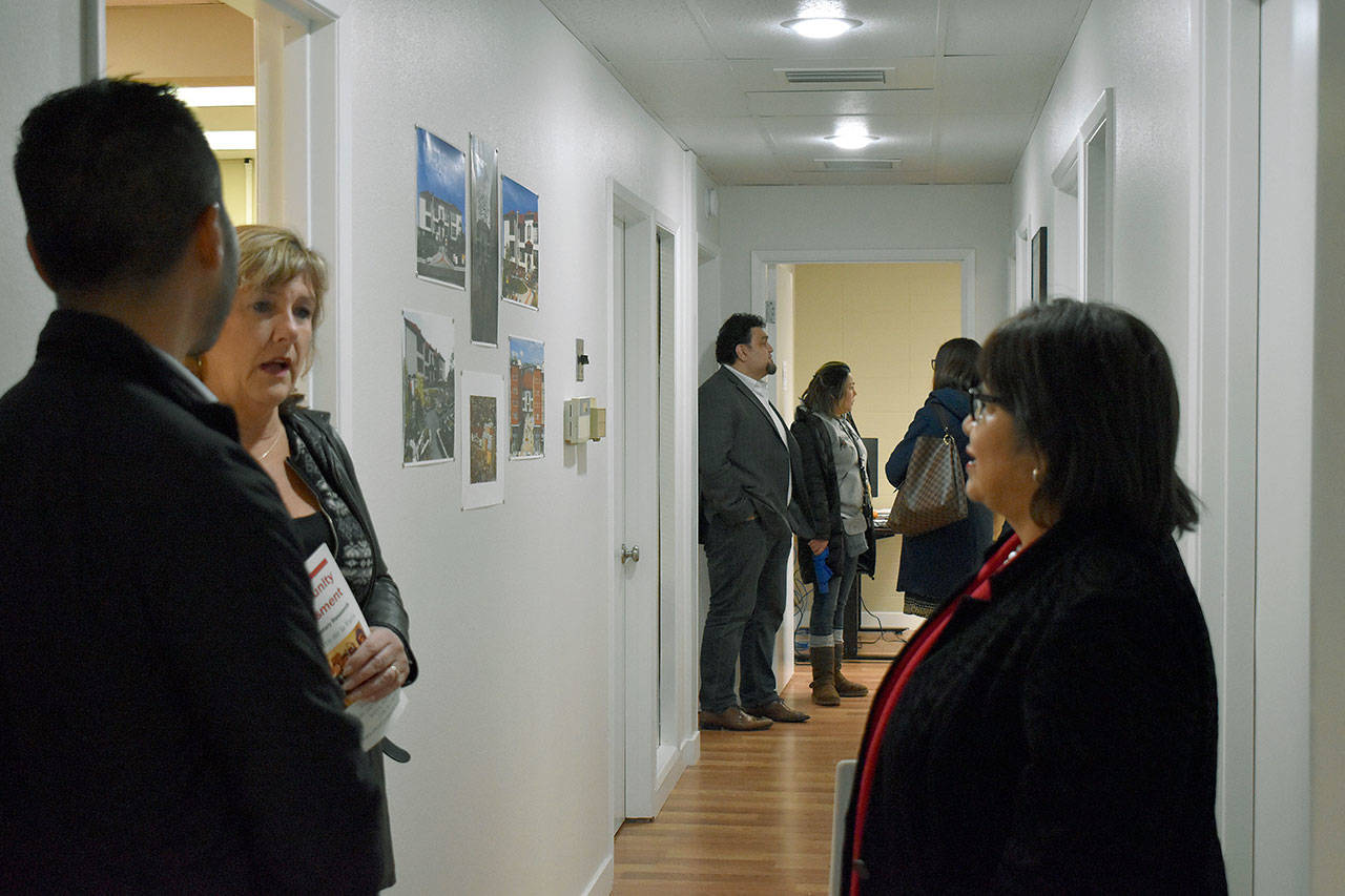 Estela Ortega (right) speaks with some guests at El Centro de la Raza’s grand opening. Haley Donwerth/staff photo