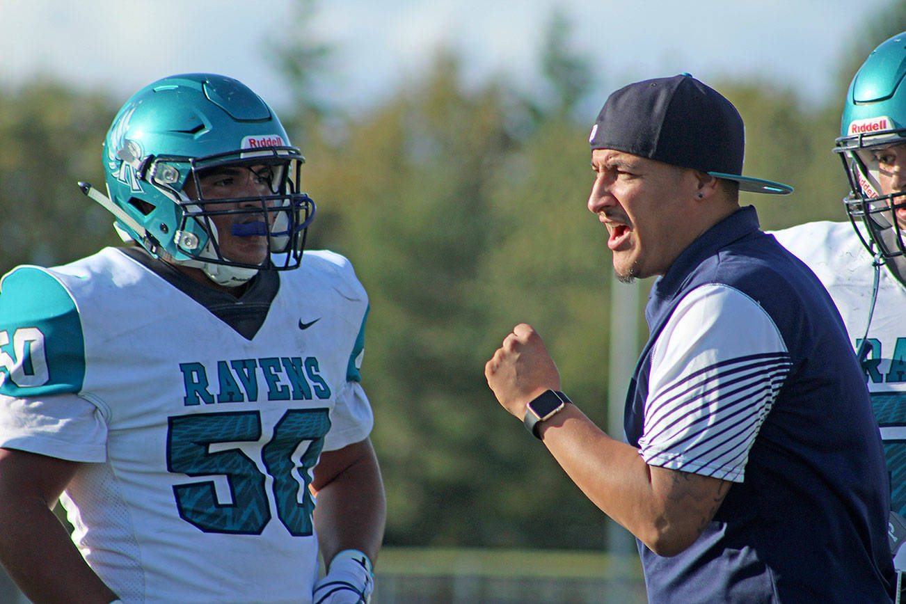 Auburn Riverside coach Marcus Yzaguirre instructs his team during their 34-7 loss to Federal Way in a North Puget Sound League Valley Division opener at Federal Way Memorial Stadium on Sept. 27, 2019. The Eagles went on take the division title later in the season. OLIVIA SULLIVAN, Federal Way Mirror