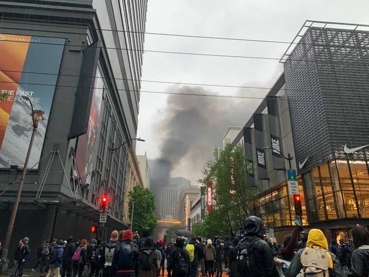 Black smoke rises from Westlake Center in Seattle as the Saturday afternoon protests result in several car fires and the looting of several downtown businesses on May 30. Courtesy photo