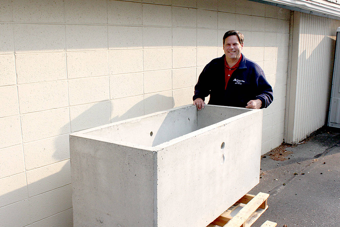 Photo courtesy of the City of Federal Way                                Mayor Jim Ferrell stands next to the city’s time capsule, set to be buried in November.