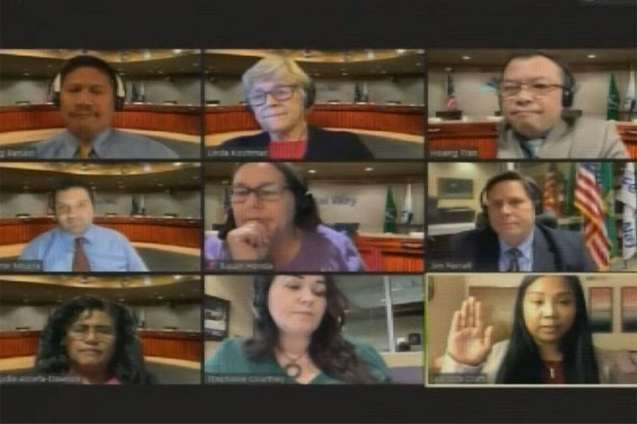 Leandra Craft, bottom right, swears in to Federal Way City Council Position 5 virtually around 10:45 p.m. on Oct. 15.