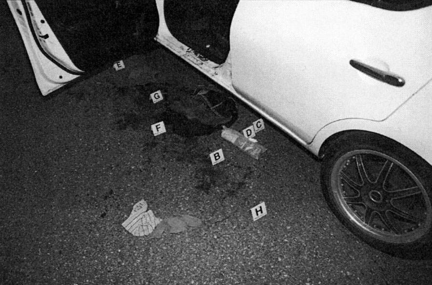 Crime scene photo shows the Nissan Versa driven by Travis Zimmerman, a newspaper carrier who was shot by Daniel McLaughlin in May 2019. Courtesy of King County Superior Court.