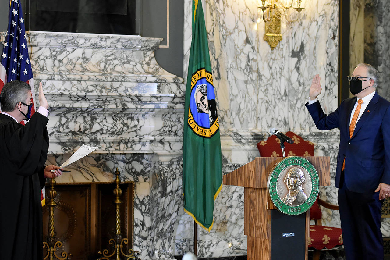 Jay Inslee takes the oath of office for his third term as governor. (Governor Jay Inslee)