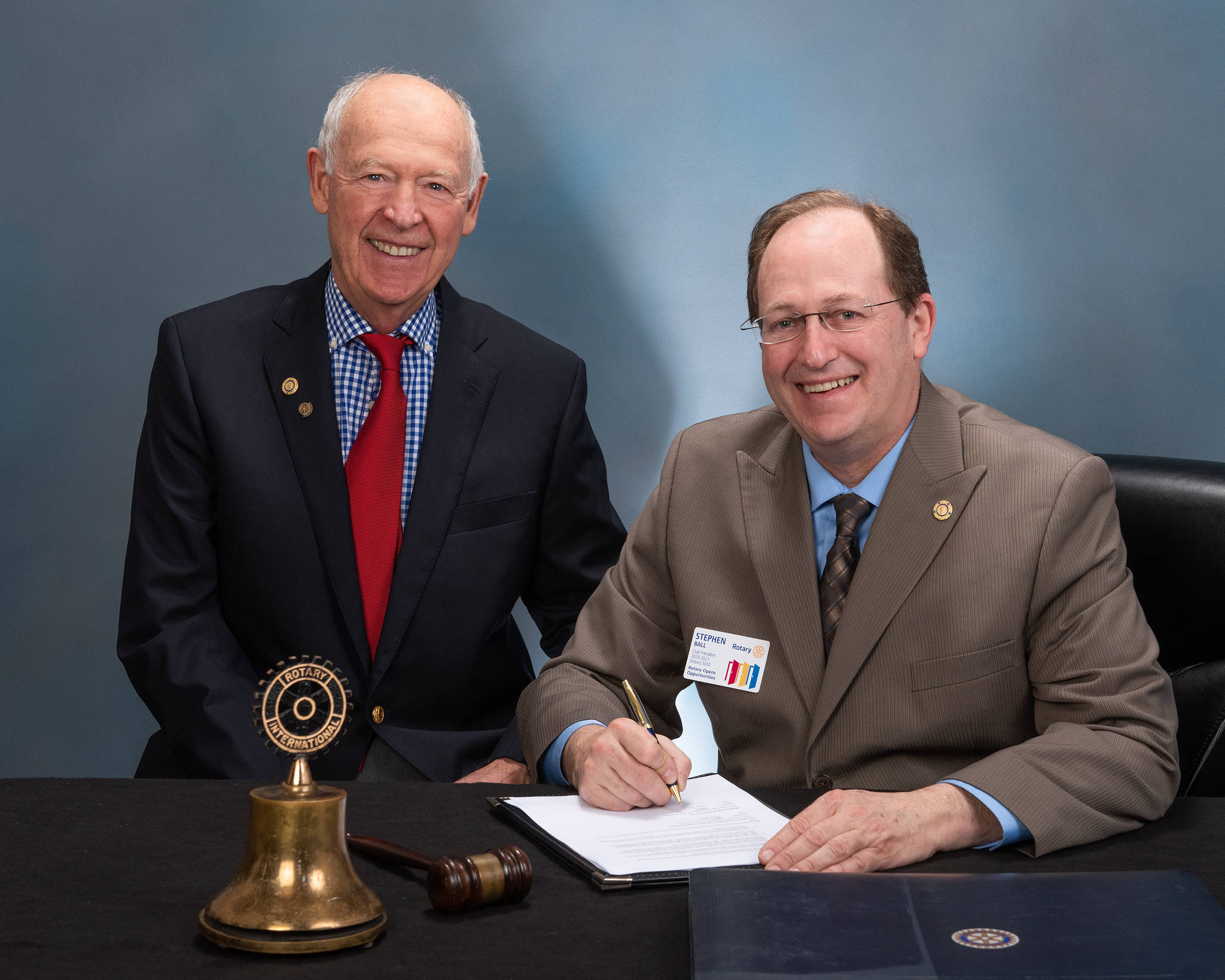 Rotary Club of Federal Way President Steve Ball, right, signs the Program of Scale agreement with the Rotary Foundation with Federal Way Rotary Club member Bill Feldt. Courtesy photo