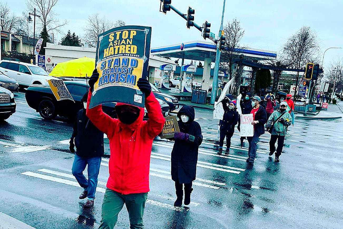 Supporters hold signs at the Stop Asian Hate rally in Federal Way on March 21. Photo courtesy of Allison Fine