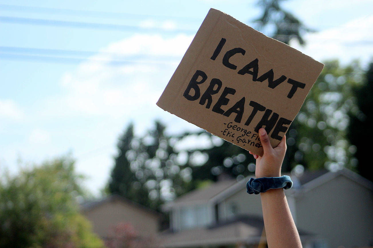 A student holds a sign that reads "I can't breathe" at the protest on June 10, 2020, outside of Thomas Jefferson High School. (Olivia Sullivan/staff photo)