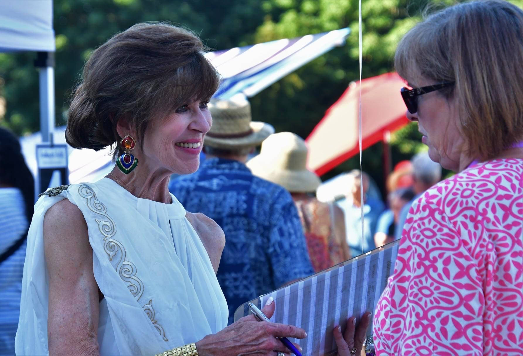 FUSION founder Peggy LaPorte greets guests at the Aug. 4 summer arts fundraiser at Dumas Bay Centre in Federal Way. Photo courtesy of Bruce Honda