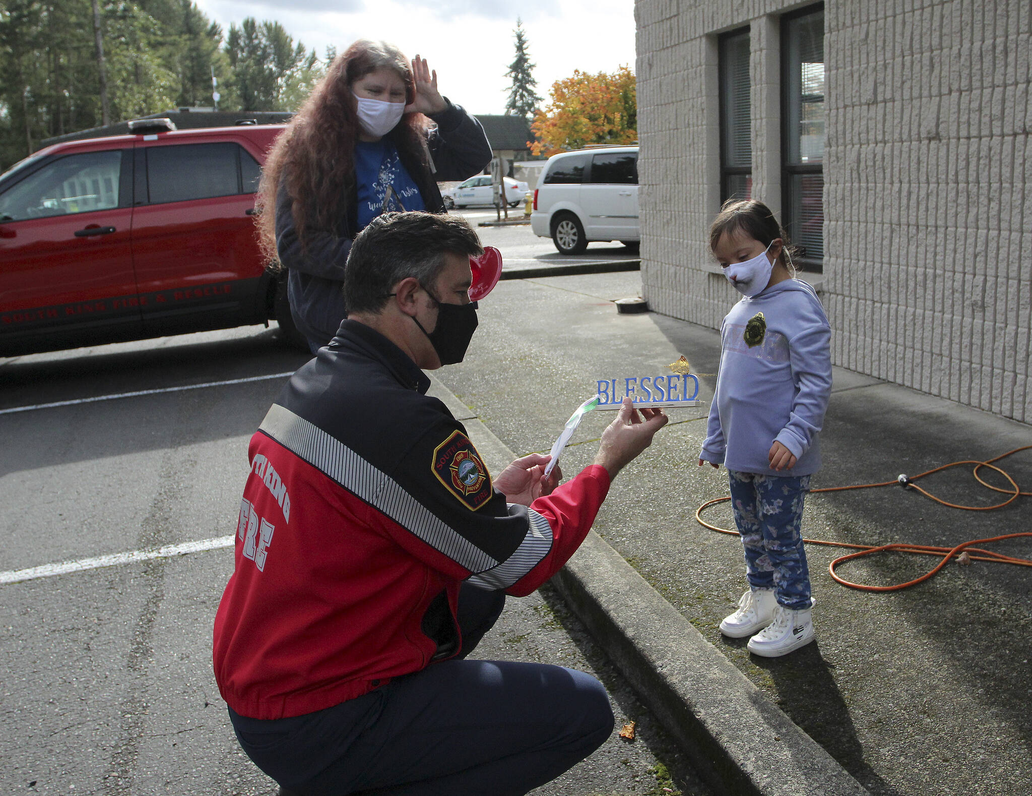 Throughout the year, Andrea and Arianna place signs around Federal Way to spread kindness and promote Down syndrome acceptance. Olivia Sullivan/the Mirror