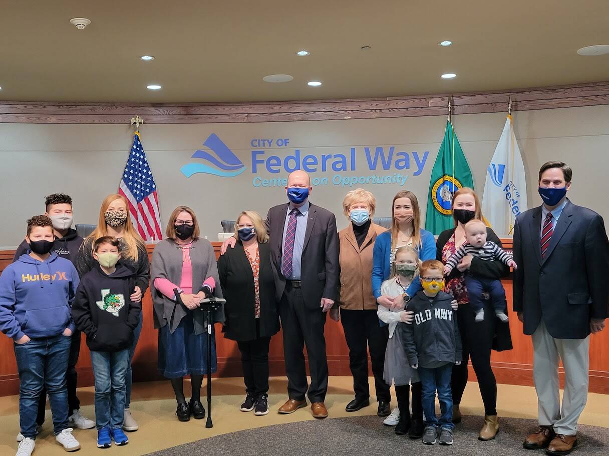 Jack Walsh, center, stands with city electeds and his family members during a private swearing-in ceremony for his council seat on Nov. 23. Photo courtesy of the City of Federal Way
