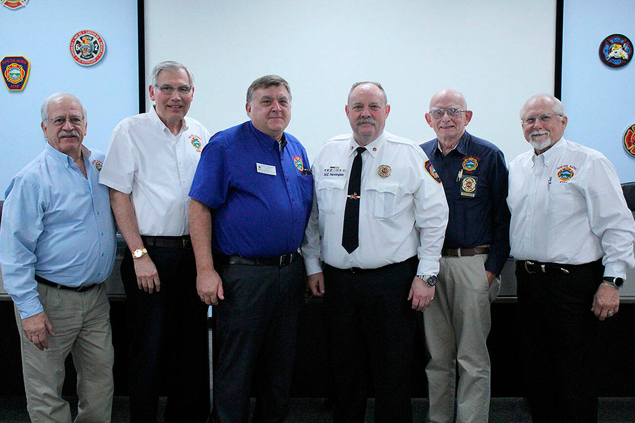 James Fossos, far right, stands with his fellow SKFR fire commissioners and Fire Chief Vic Pennington at a commissioner's meeting on Feb. 26, 2019. Olivia Sullivan/staff photo