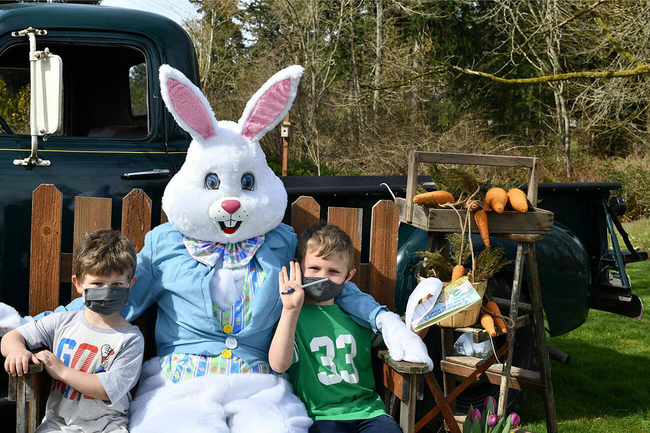 Kids enjoy a visit with the Easter Bunny in 2021 at Light of Christ Community Garden. Photo courtesy of Shelley Pauls