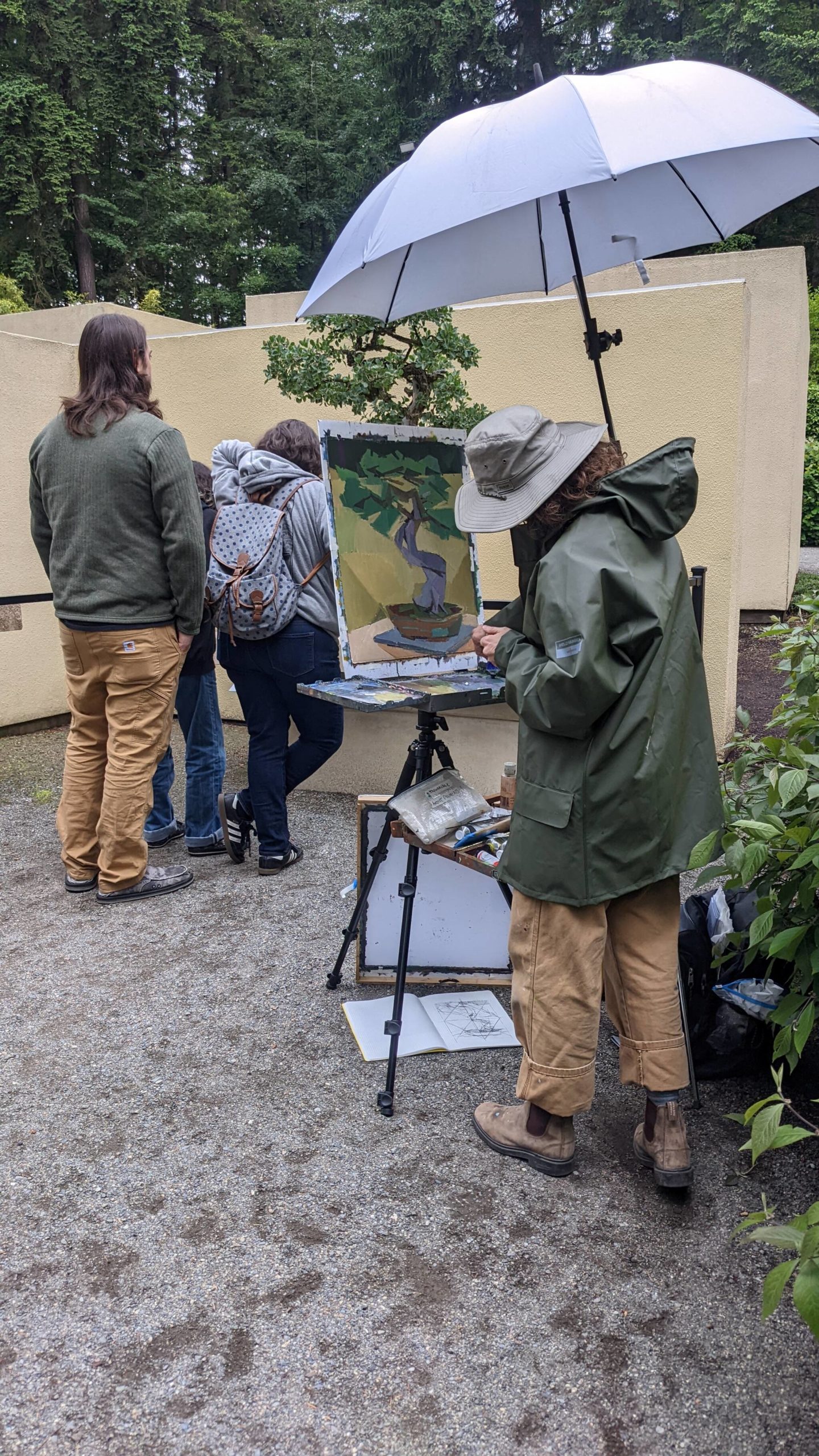 Kimberly Trowbridge painting Tucker Oak Bonsai at the Pacific Bonsai Museum on June 18. Sarah Fox/Sound Publishing