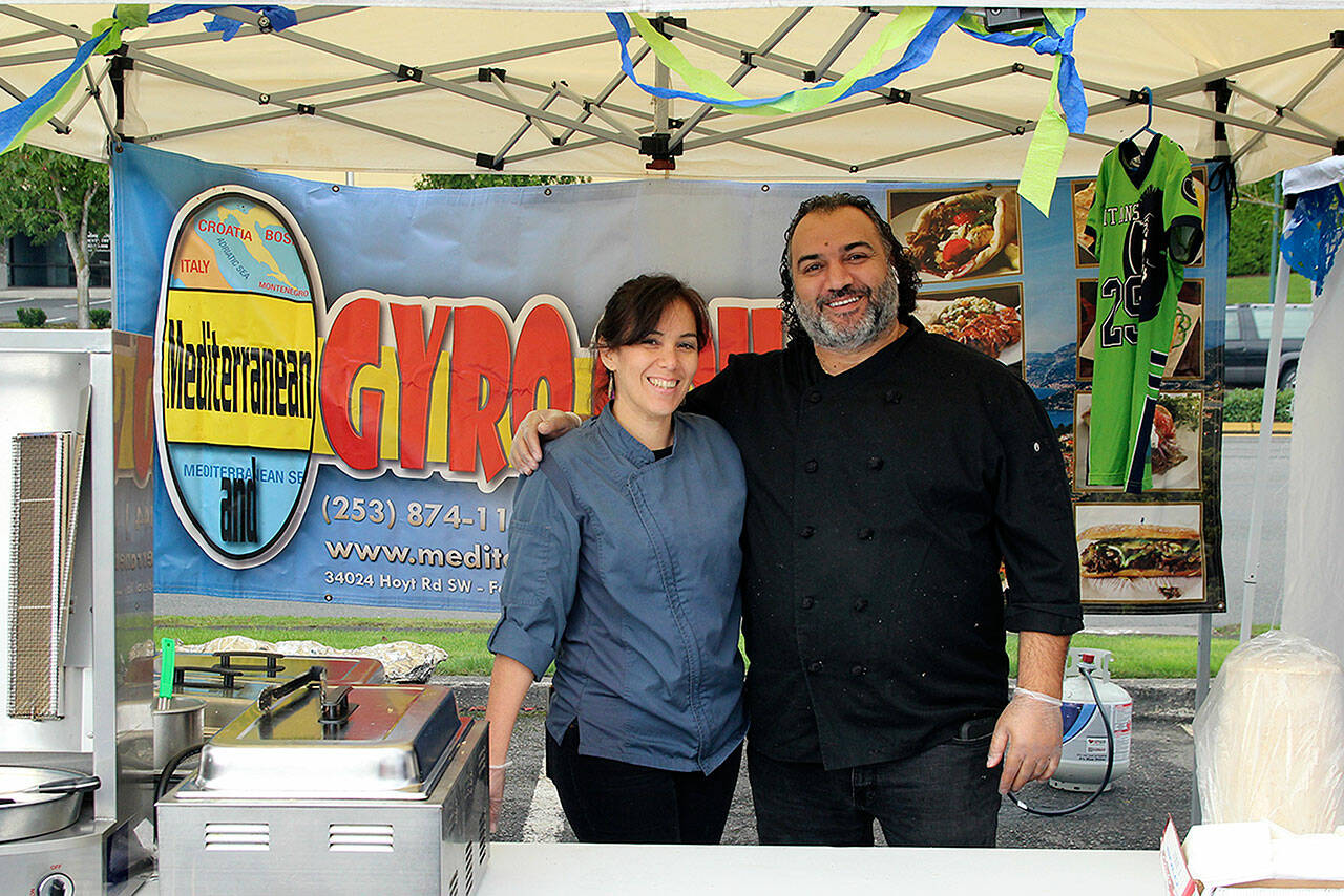 Mediterranean Gyro Grill owner Jay Barbour, right, and his restaurant manager pictured at the Taste of Federal Way in 2019. Olivia Sullivan/staff photo