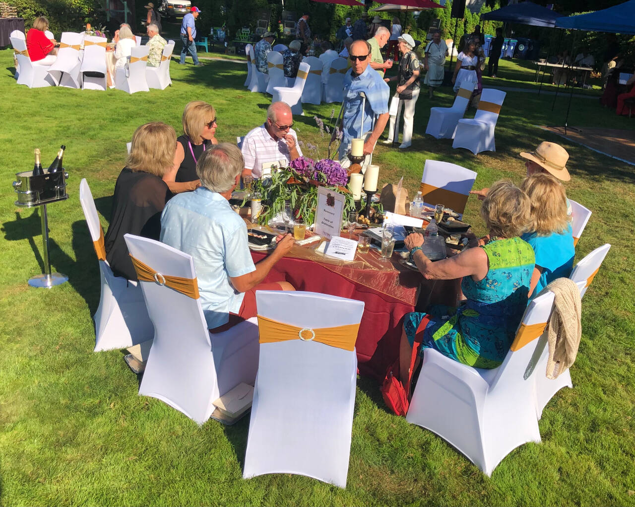 Attendees gathered around tables for food and conversation during the 2021 FUSION arts festival at Dumas Bay Centre.