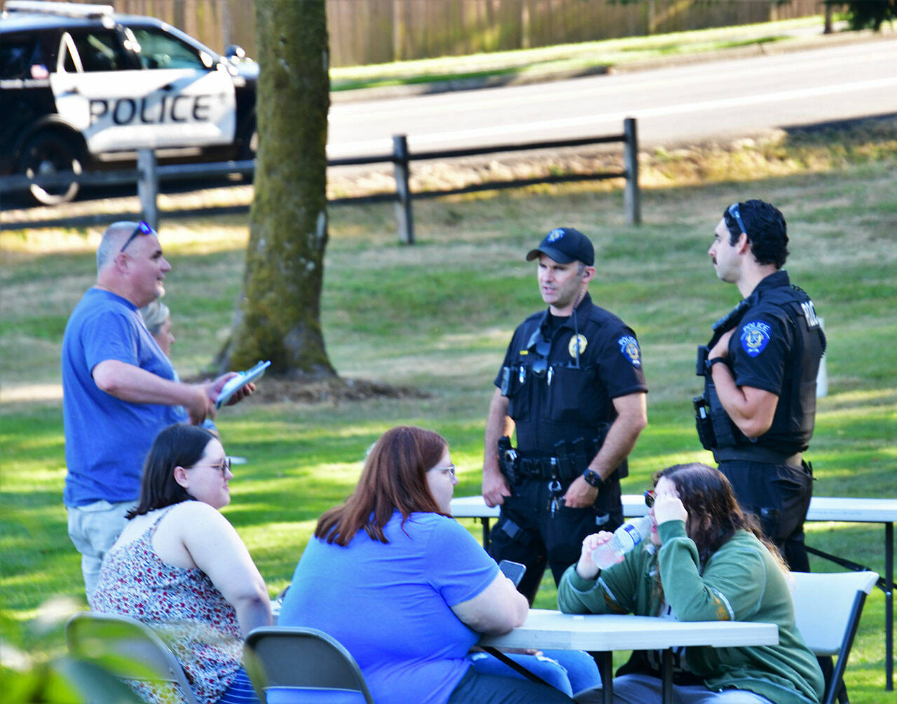 Members of the Federal Way Police Department chat with community members on Aug. 2. Photo by Bruce Honda