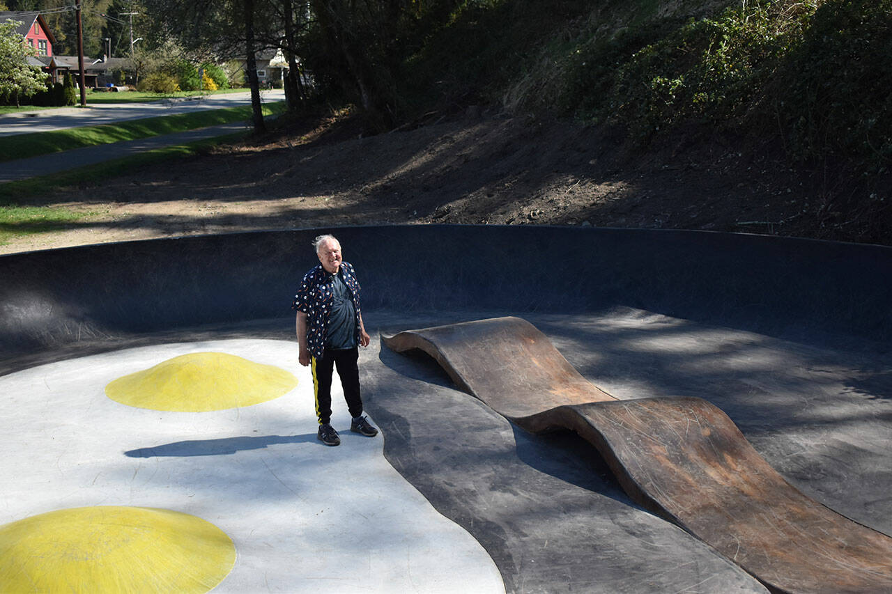 John Hillding stands in the center of the Bacon and Eggs skatepark, which he designed. The Wilkeson skatepark came about from a state grant, Grindline Skateparks, organizing by Hillding and city leaders, and a lot of volunteers. All photos by Alex Bruell