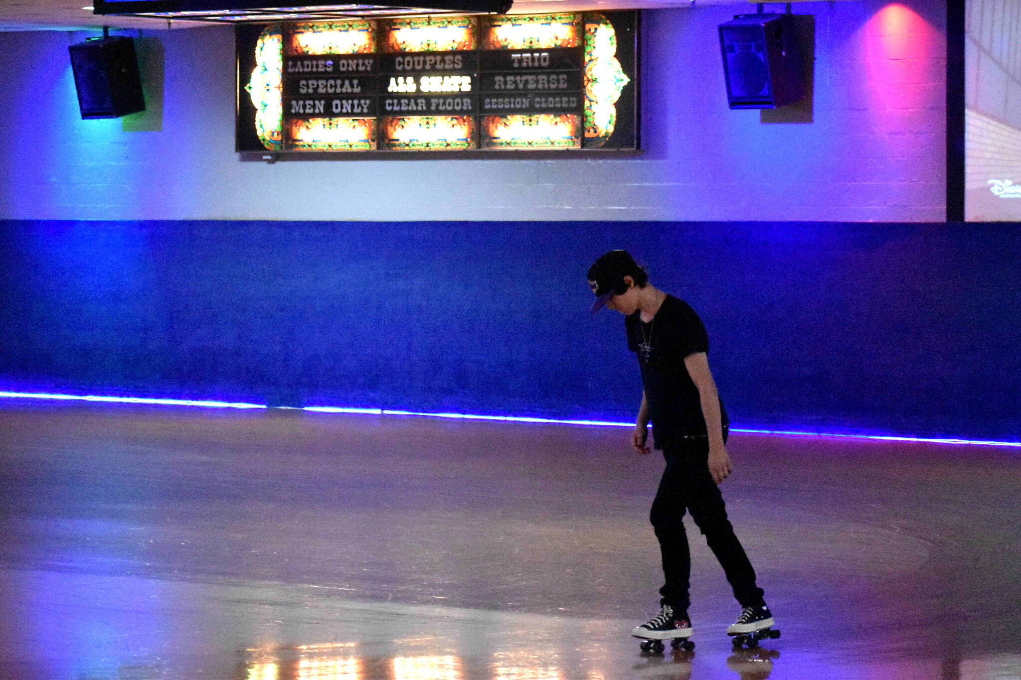 T.K., an employee at Pattison’s West, practices some moves before the rink opens Tuesday afternoon. Alex Bruell/Sound Publishing
