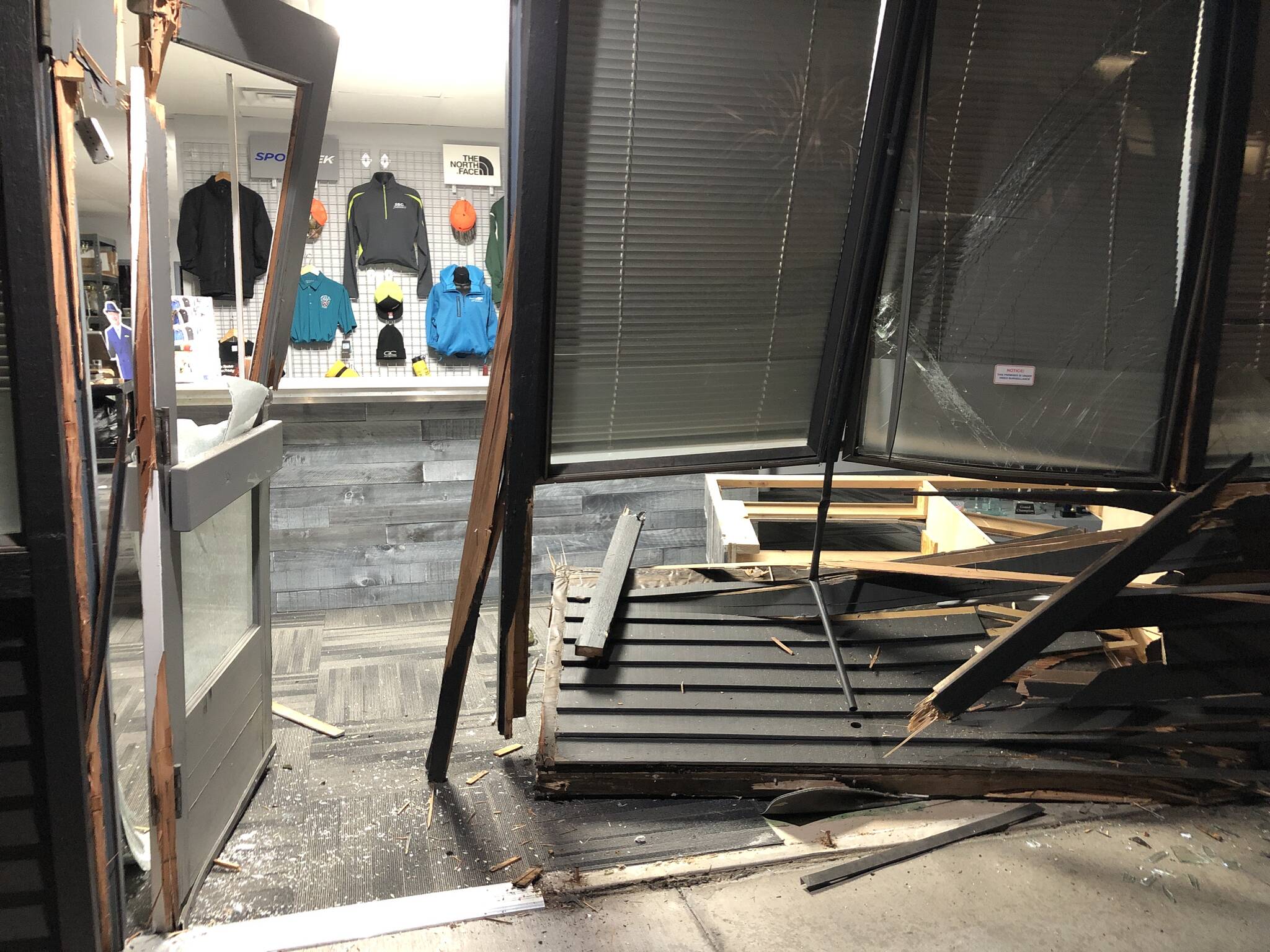 The front entrance to DJ Trophy, Awards & Engraving is heavily damaged after a suspect rammed a truck into the building and stole several items on Sept. 30. Federal Way Police photo